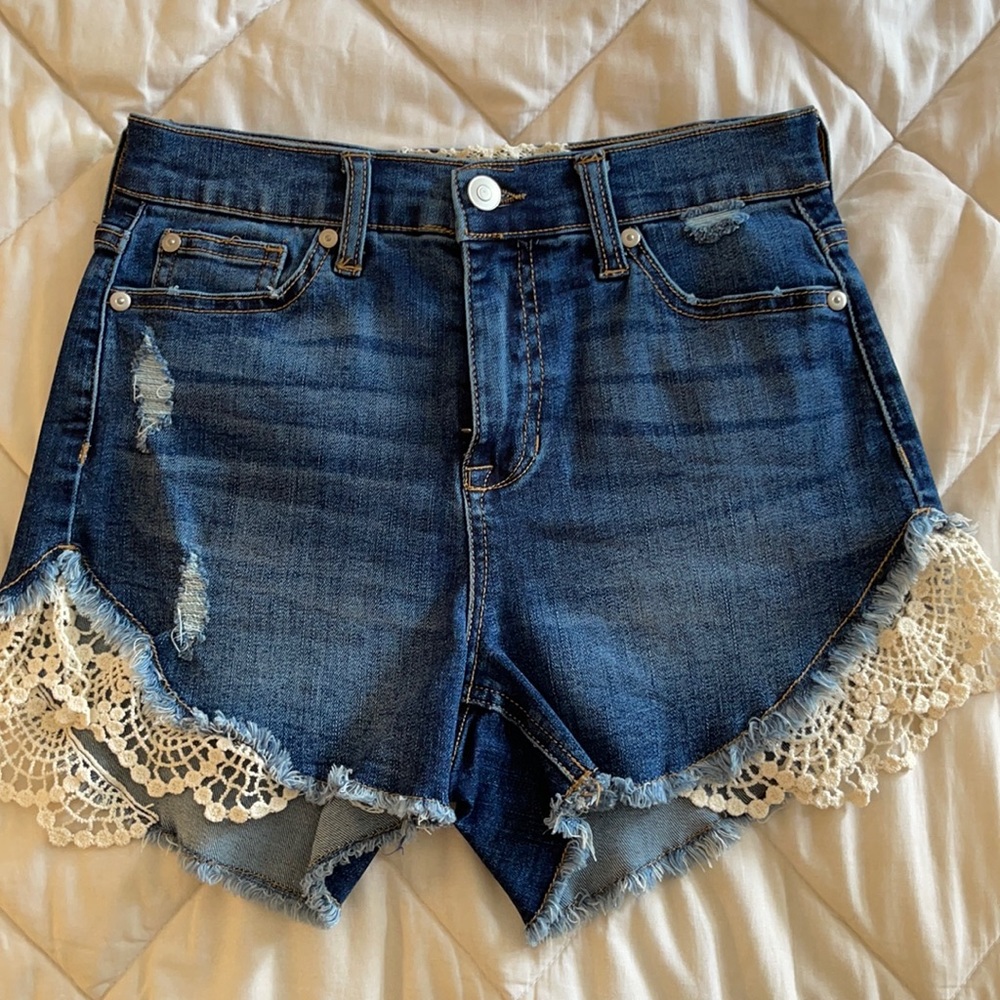 dark wash jean shorts with crochet on sides